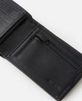 Detalle interior de cartera Rip Curl Corpawatu Icon PU Slim negra con monedero con cremallera y compartimentos organizadores