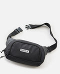 Riñonera Rip Curl Waist Bag Icons negra extendida, mostrando correa desmontable y cierre de clip.