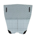 Grip de surf de dos piezas Deflow 2 Piece Traction II en color granite gris moteado, vista frontal con textura de cubos de espuma sobre fondo blanco.