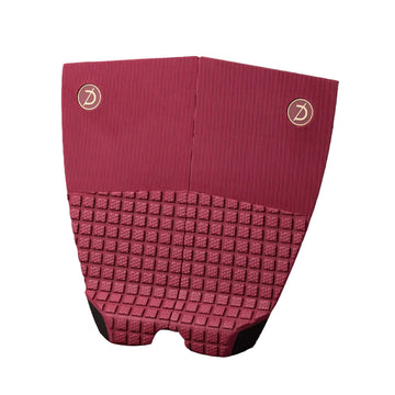  Grip de surf de dos piezas Deflow 2 Piece Traction en color burgundy, vista frontal con textura de cubos de espuma y superficie lisa sobre fondo blanco.