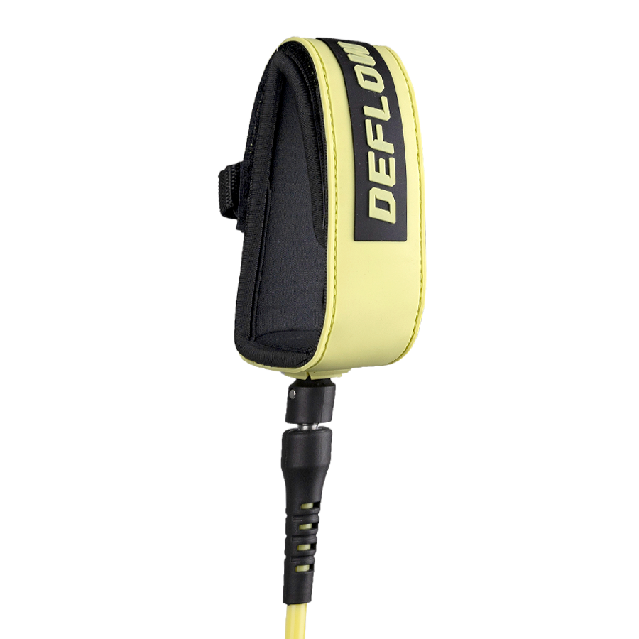 Detalle del tobillero del leash Deflow Core Leash Acid Lemon con interior de neopreno y cierre de velcro en color amarillo-verde eléctrico sobre fondo blanco.