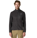 Chaqueta polar Patagonia R1 Air Fleece en color Negro, vista frontal en plano cenital con el bolsillo de pecho, la cremallera frontal y la etiqueta Patagonia.