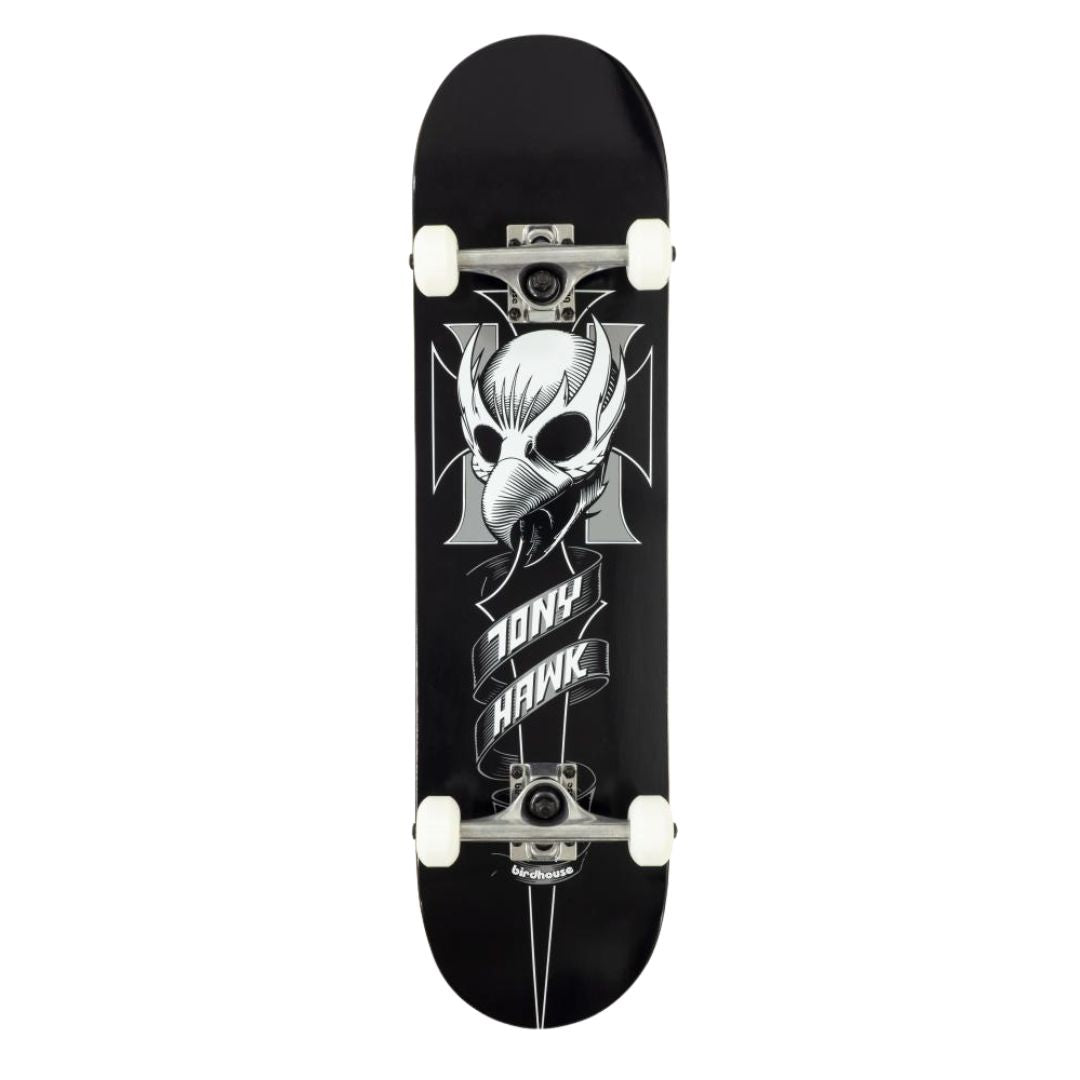 Base completa del skate Birdhouse Stage 1 Hawk Crest en negro, blanco y gris con la calavera de ave y la cruz de hierro, trucks plateados, ruedas blancas y logo Birdhouse