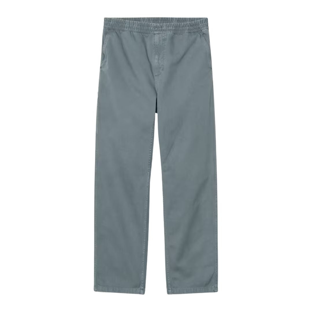 Pantalón Carhartt WIP Flint Pant en color azul grisáceo con cintura elástica, vista frontal.