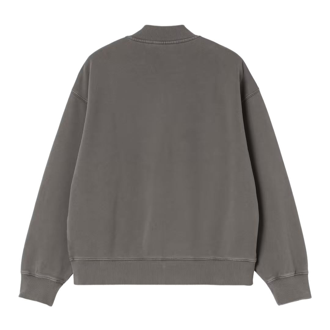 Vista trasera de chaqueta bomber Carhartt WIP gris garment dyed con acabado lavado y puños acanalados.