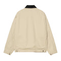 Carhartt WIP OG Detroit Jacket Barchan Black Rinsed vista trasera, chaqueta workwear de canvas Dearborn beige con cuello de pana negro, corte loose OG fit y cintura ajustable con botones.