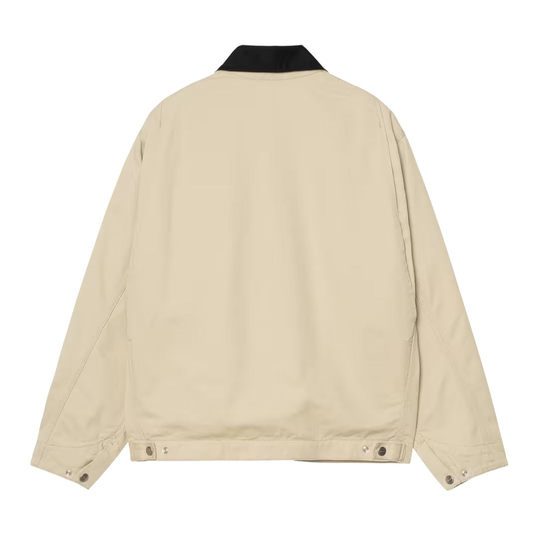 Carhartt WIP OG Detroit Jacket Barchan Black Rinsed vista trasera, chaqueta workwear de canvas Dearborn beige con cuello de pana negro, corte loose OG fit y cintura ajustable con botones.