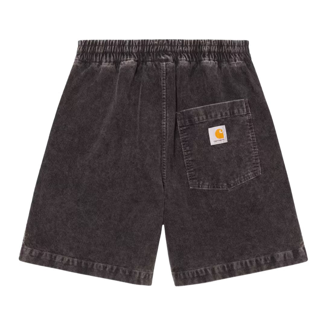 Pantalón corto Carhartt WIP Reynold Short de pana en color shale dusky light wash, vista trasera con bolsillo y etiqueta tejida.
