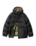 Chaqueta acolchada Carhartt WIP Toronto Jacket negra con el interior camo abierta