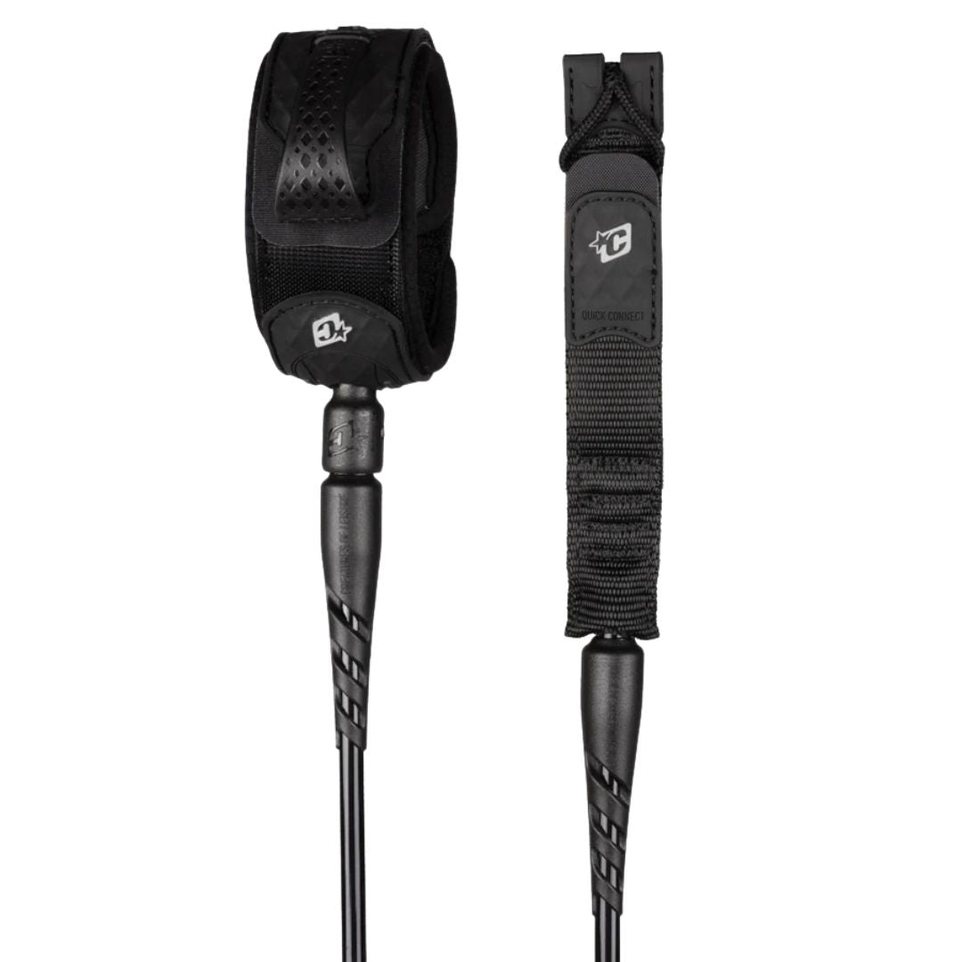 Leash de surf Creatures of Leisure Reliance 2.0 Medium Duty 6' black silver: vista completa de tobillera negra con logo plateado, doble swivel y cordón negro de 6 mm.