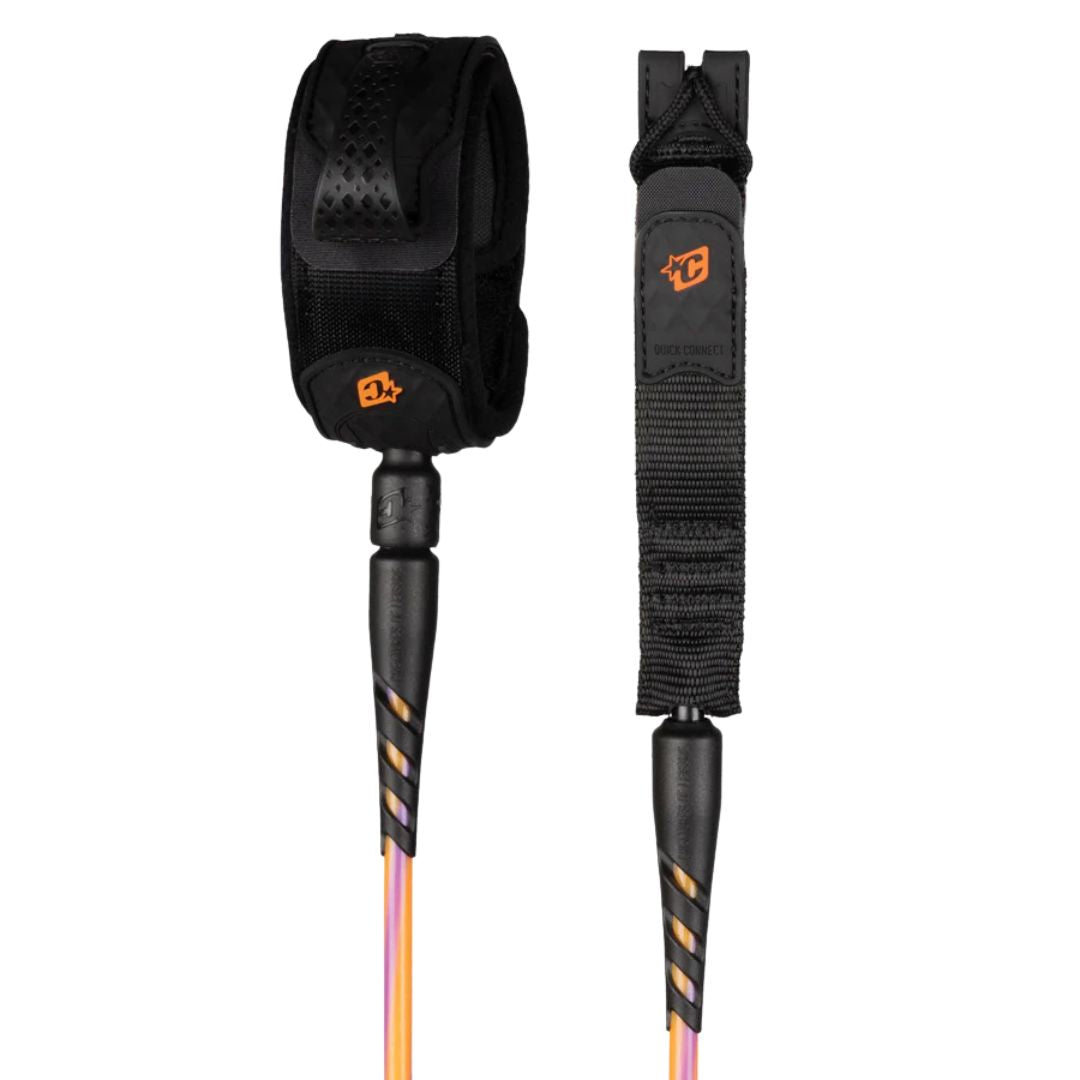 Leash de surf Creatures of Leisure Reliance 2.0 Standard Duty 6' hi-vis purple twist black: vista completa de tobillera negra con logo naranja, doble swivel y cordón naranja y morado de 7 mm.