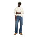 Look completo con vaqueros Dickies 954 Relaxed Straight Work Jeans classic blue de corte relaxed y pierna recta, combinados con jersey de punto con logo Dickies, gorra y zapatillas.