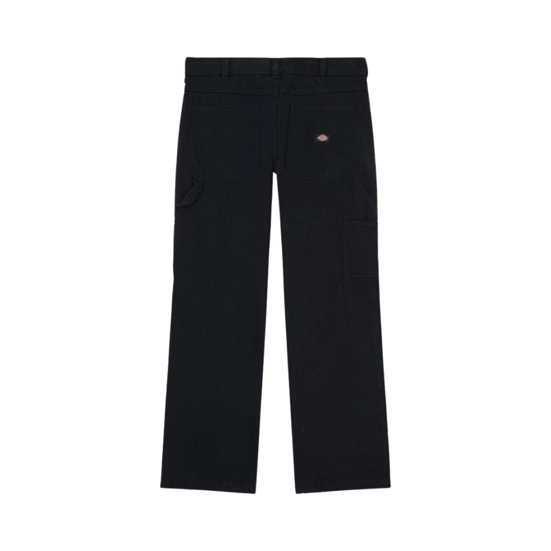 Pantalón Dickies Carpenter Canvas en color negro visto por detrás, corte recto y bolsillos traseros con etiqueta tejida.