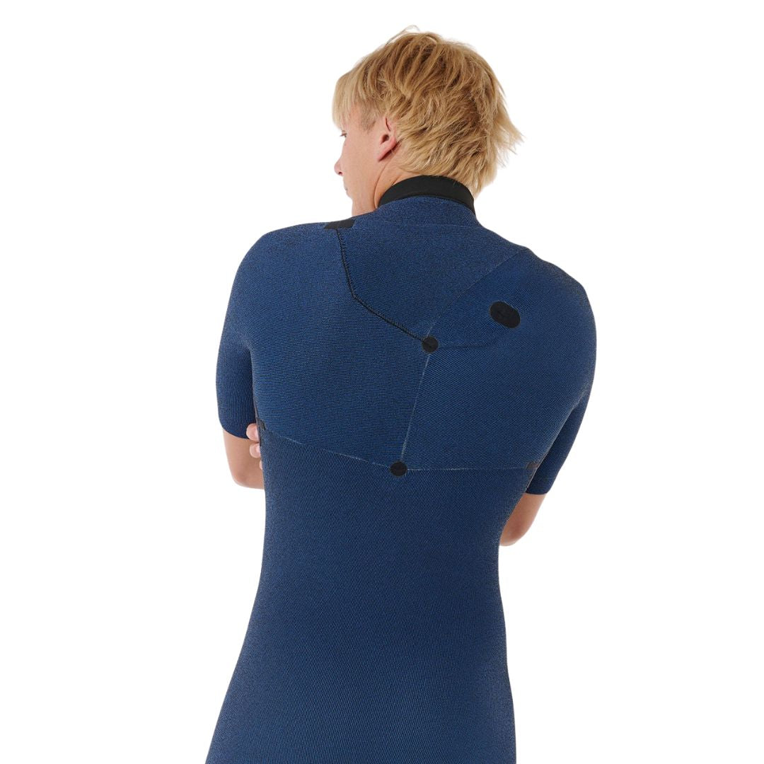 Detalle de la espalda superior del traje Rip Curl E-Bomb 2/2 azul marino jaspeado sin cremallera, con costuras en V, puntos de refuerzo negros y cuello alto de neopreno.