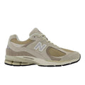 Zapatillas New Balance 2002R en color Shipyard con Incense y Timberwolf, vista lateral