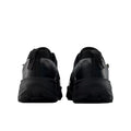 New Balance Hierro v9 GORE-TEX® en negro con Faded Black y Castlerock, vista trasera del par mostrando el contrafuerte acolchado y el lazo tirador del talón para calzarlas fácilmente.