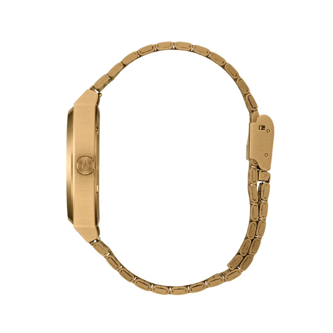 Reloj Nixon Time Teller Gold Green Sunray visto desde atrás con cierre metálico dorado y grabado Nixon.