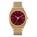 Reloj Nixon Time Teller color dorado con esfera rojo oxblood sunray, visto de frente.