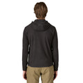 Patagonia Men's R1 Air Full-Zip Hoody en color negro, vista trasera, con capucha ceñida, tejido jacquard en zigzag de poliéster reciclado y ribete tejido en el bajo.