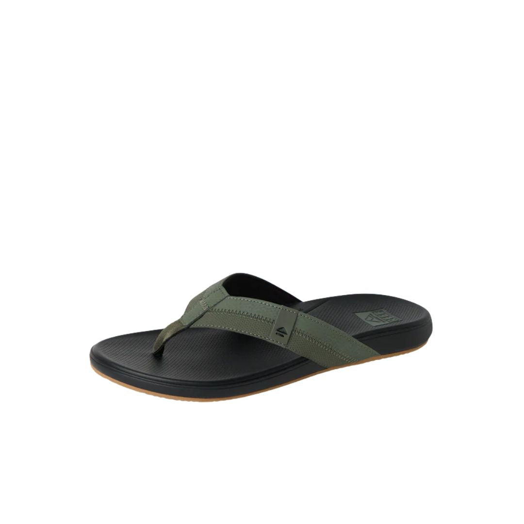 Chanclas Reef Cushion Phantom 2.0 verde oliva con plantilla acolchada negra y tira suave para máximo confort.
