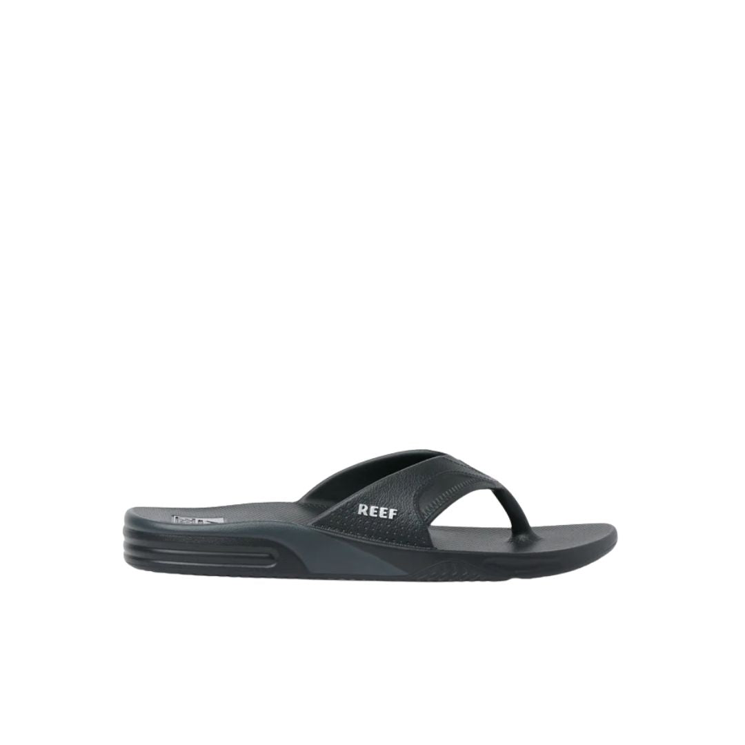 Perfil lateral chanclas Reef Fanning H2O negras con suela ligera EVA y diseño cómodo para uso en agua.