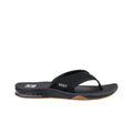 Vista lateral de las chanclas REEF Fanning en color negro con suela marrón, diseño cómodo y deportivo para hombre.