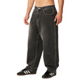 Rip Curl Archive Dirty Denim Pant en Washed Grey, vista lateral de tres cuartos, mostrando la caída suelta del corte baggy y las costuras de contraste.