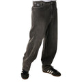 Detalle de la cintura y pernera lateral del Rip Curl Archive Dirty Denim Pant en Washed Grey, mostrando el lavado sucio y las costuras de contraste.