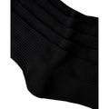 Primer plano de la textura de punto acanalado en negro de los calcetines Rip Curl Brand Crew Sock, mostrando el grosor y la trama del tejido.