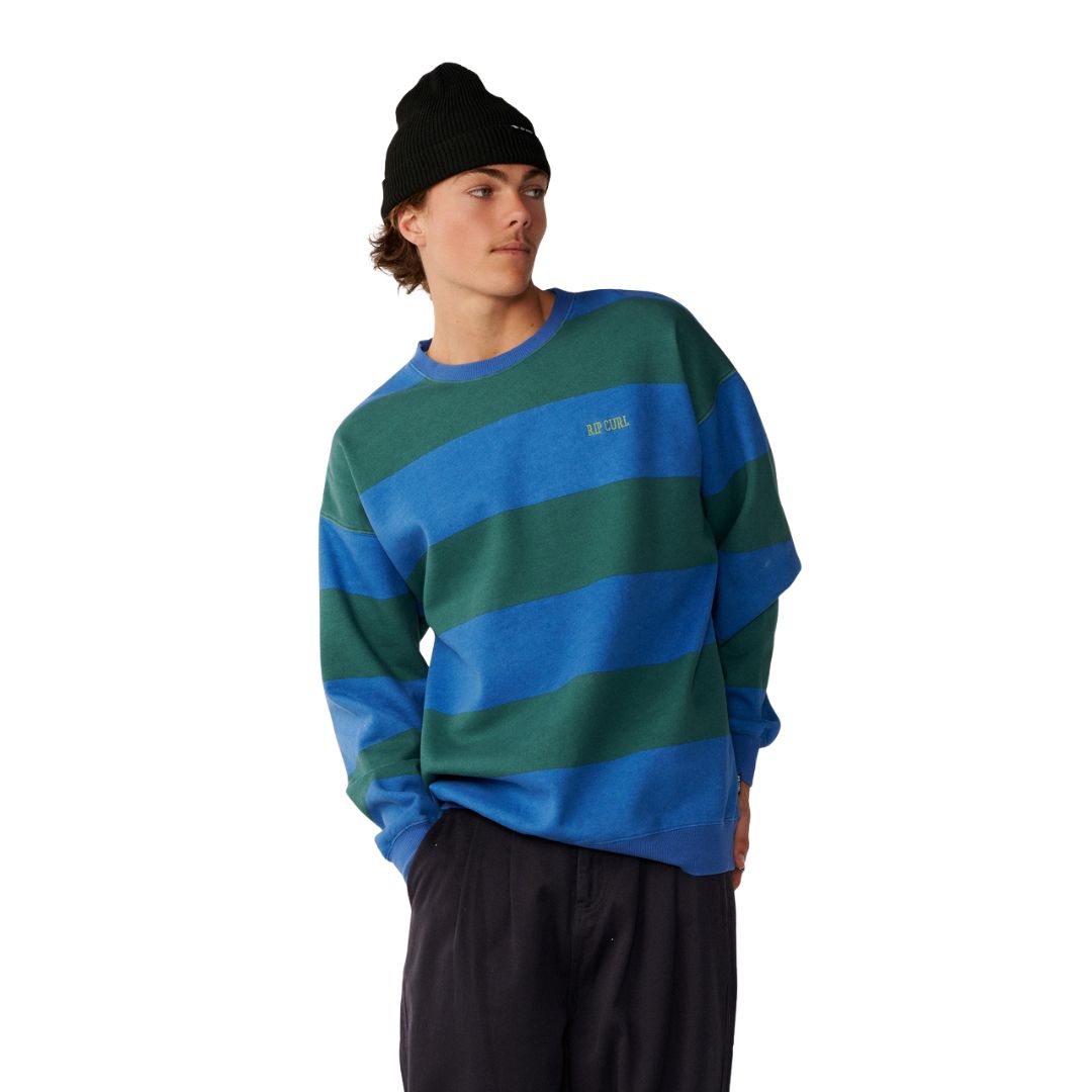 Sudadera Rip Curl Disorder Stripe Crew en Riverside, vista frontal de tres cuartos, con rayas anchas en bloque azul y verde y gorro negro a juego.