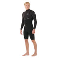 Traje de primavera Rip Curl E-Bomb 2/2mm Zip Free negro, vista lateral en tres cuartos: manga larga, pierna corta, logos en pecho y manga, cierre Zip Free y línea en V en cintura.