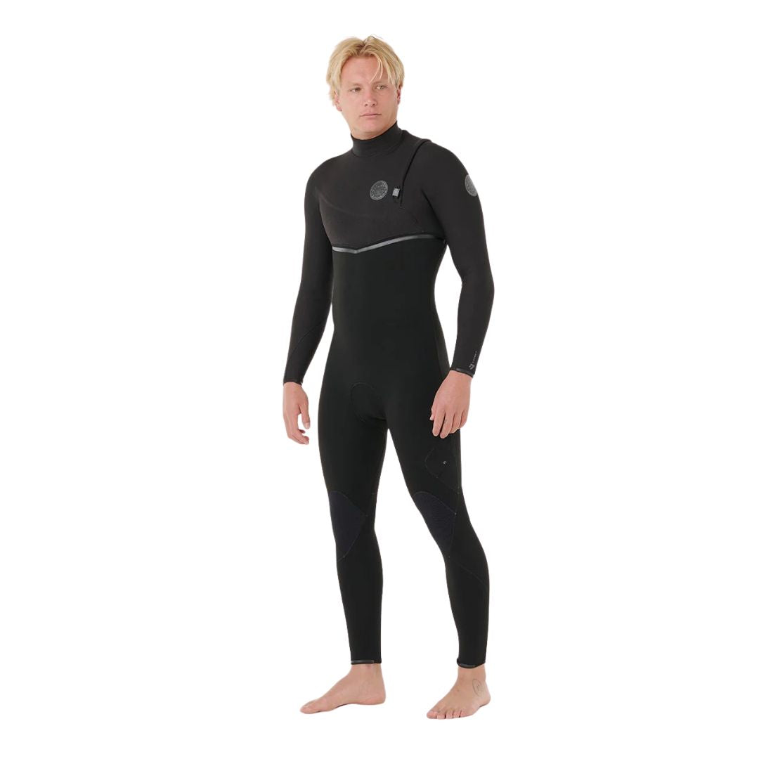 Neopreno surf hombre negro Rip Curl E-Bomb Zip Free 3/2, vista frontal lateral, sistema zip free, panel de malla E7 en pecho y rodilleras negras.