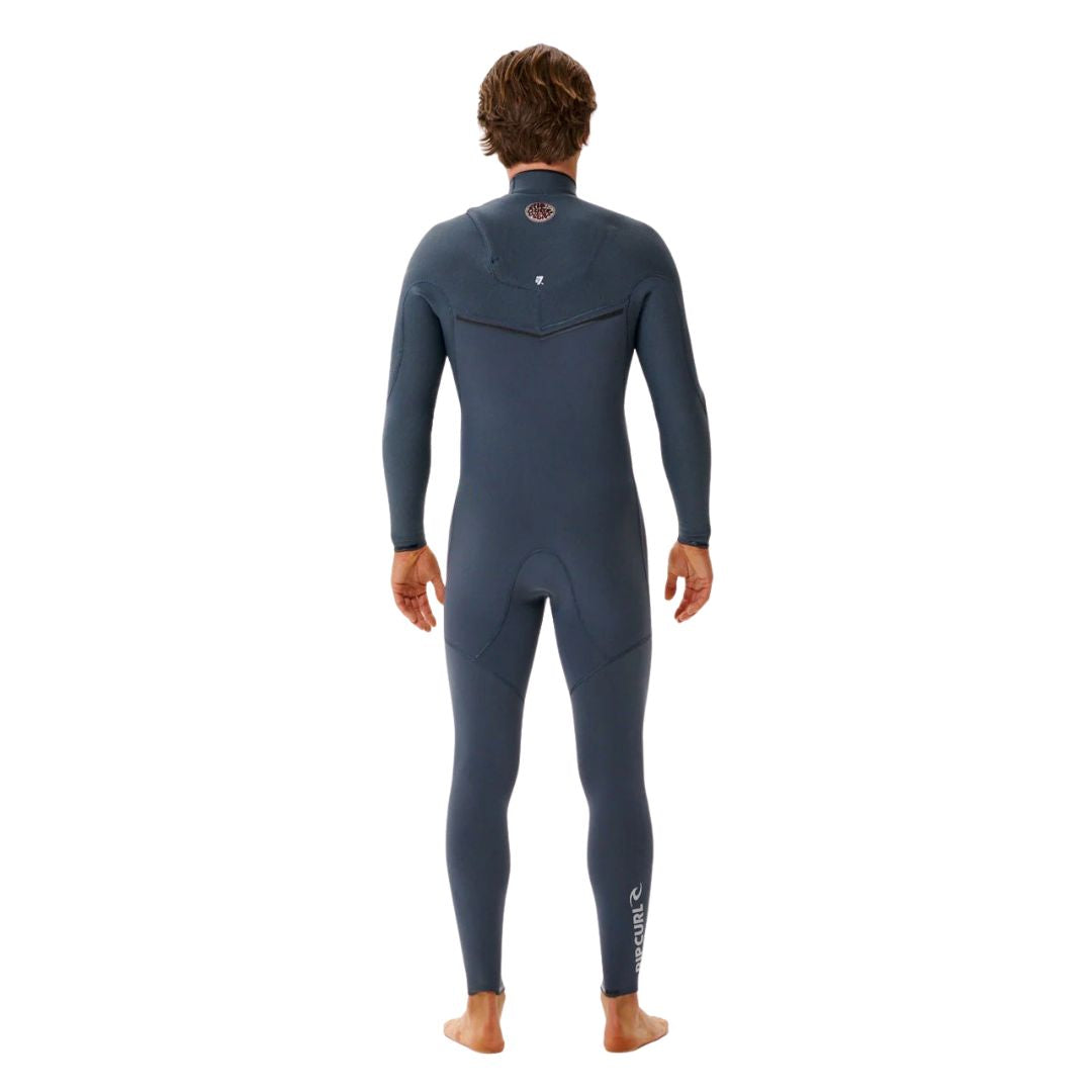 
Neopreno surf color iron Rip Curl E-Bomb Zip Free 3/2, vista trasera completa con paneles ergonómicos, rodilleras negras y logo Rip Curl en pierna.