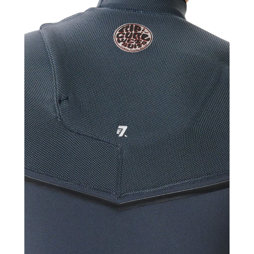 Detalle espalda neopreno iron Rip Curl E-Bomb Zip Free 3/2, panel de malla E7 en zona lumbar con logo Rip Curl Wetsuits y costuras GBS selladas.
