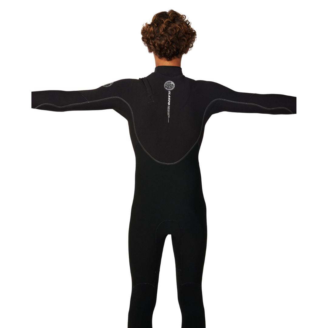Rip Curl Elasto Zip Free 5/4 en negro, vista trasera con brazos extendidos, mostrando el corte ergonómico de hombros y el logo Elasto en la espalda.