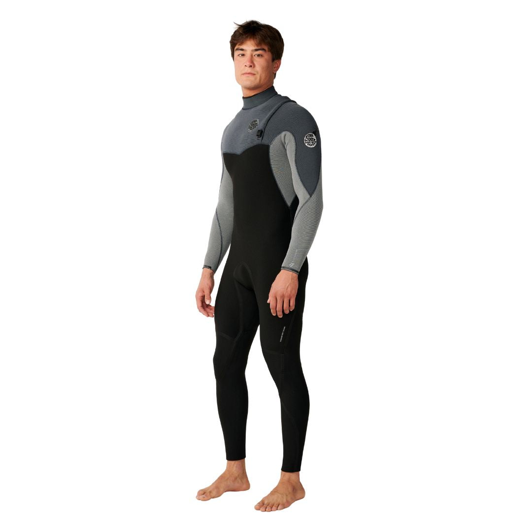 Traje de neopreno RIP CURL FLASHBOMB PRO 4/3 ZIP FREE en Charcoal Grey, vista lateral mostrando el corte ergonómico sin cremallera y las mangas jaspeadas de alta flexibilidad para surf de alto rendimiento.