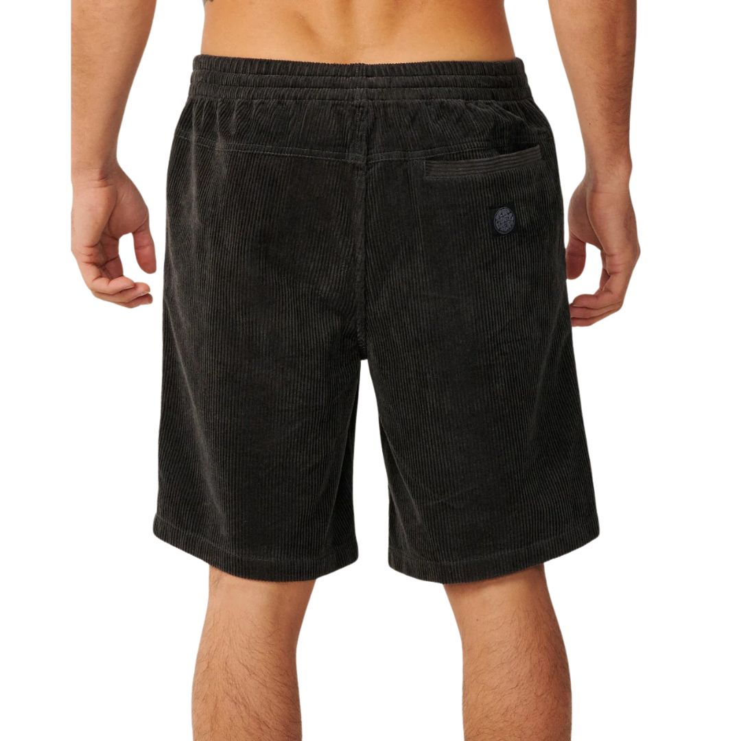 Pantalón corto pana Rip Curl Premium Surf Cord negro, vista trasera con bolsillo de ojal, etiqueta tejida circular Rip Curl y cintura elástica acid wash.