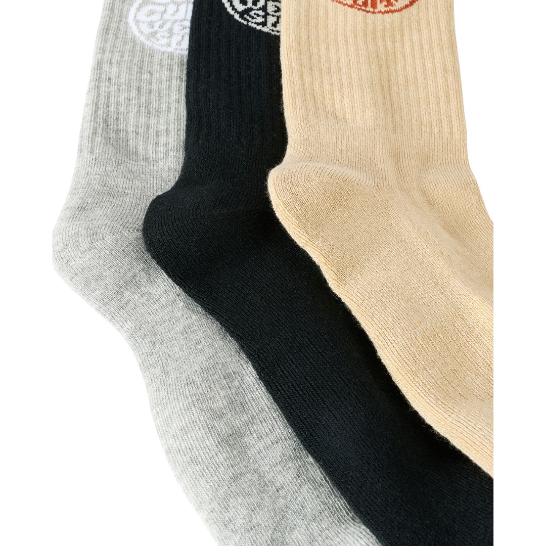 Detalle en ángulo del talón y puño acanalado de los calcetines Rip Curl Wetty Crew Sock en gris jaspeado, negro y beige, mostrando la trama de punto grueso.