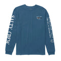 Camiseta Salty Crew Bruce LS Tee color cast blue vista frontal, camiseta de manga larga con pequeño gráfico de tiburón y logo Salty Crew en el pecho.