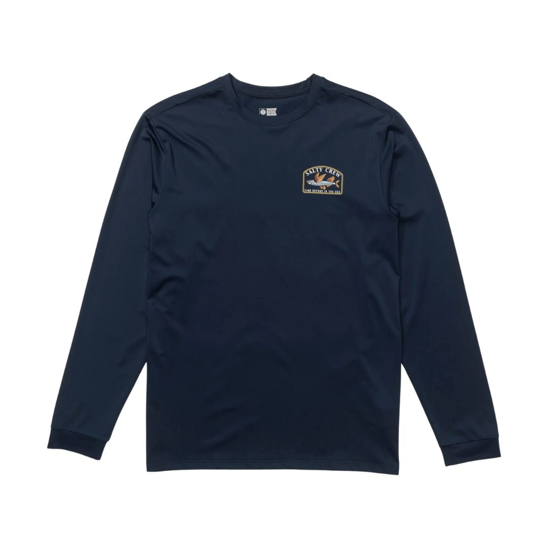 Camiseta técnica Salty Crew Fly Home LS Sunshirt color navy vista frontal, camiseta de manga larga con pequeño logo Salty Crew y gráfico de pez en el pecho.