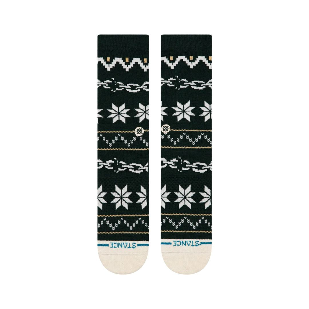 Calcetines Stance Break The Season Crew color verde pino con diseño festivo de copos de nieve blancos, vista superior extendida.