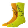 Calcetines Stance Grinch And Max Crew con diseño navideño de The Grinch y su perro Max, colores verde lima y naranja, vista lateral en perspectiva.