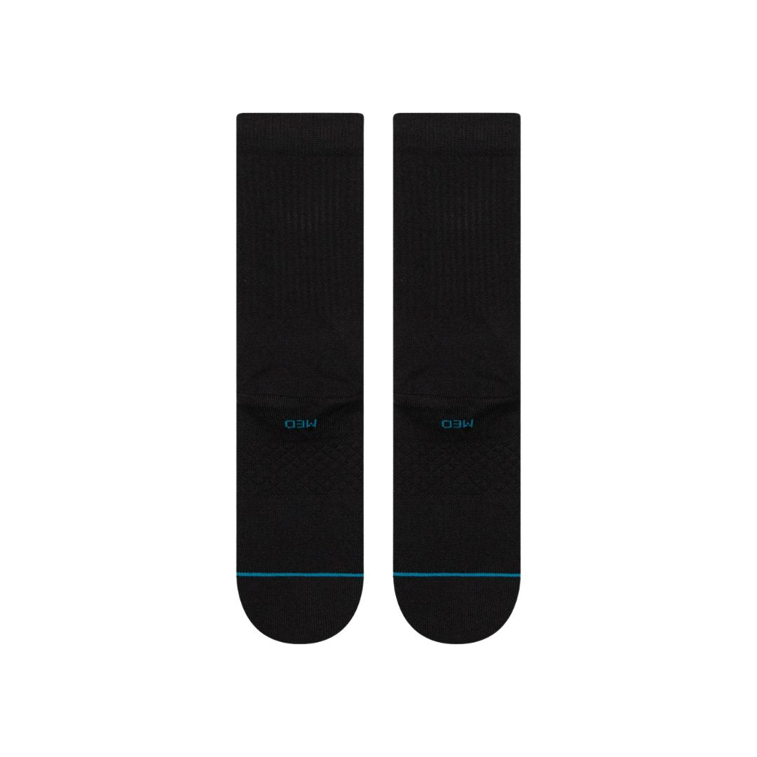 Calcetines Stance Icon Crew black white vista trasera, diseño minimalista negro con logo Stance bordado y detalle en la puntera.
