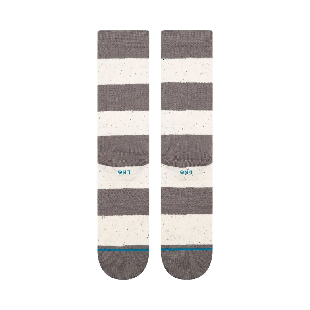 Calcetines Stance Nep Stripe Crew color gris jaspeado y blanco con diseño de rayas anchas, vista inferior extendida.