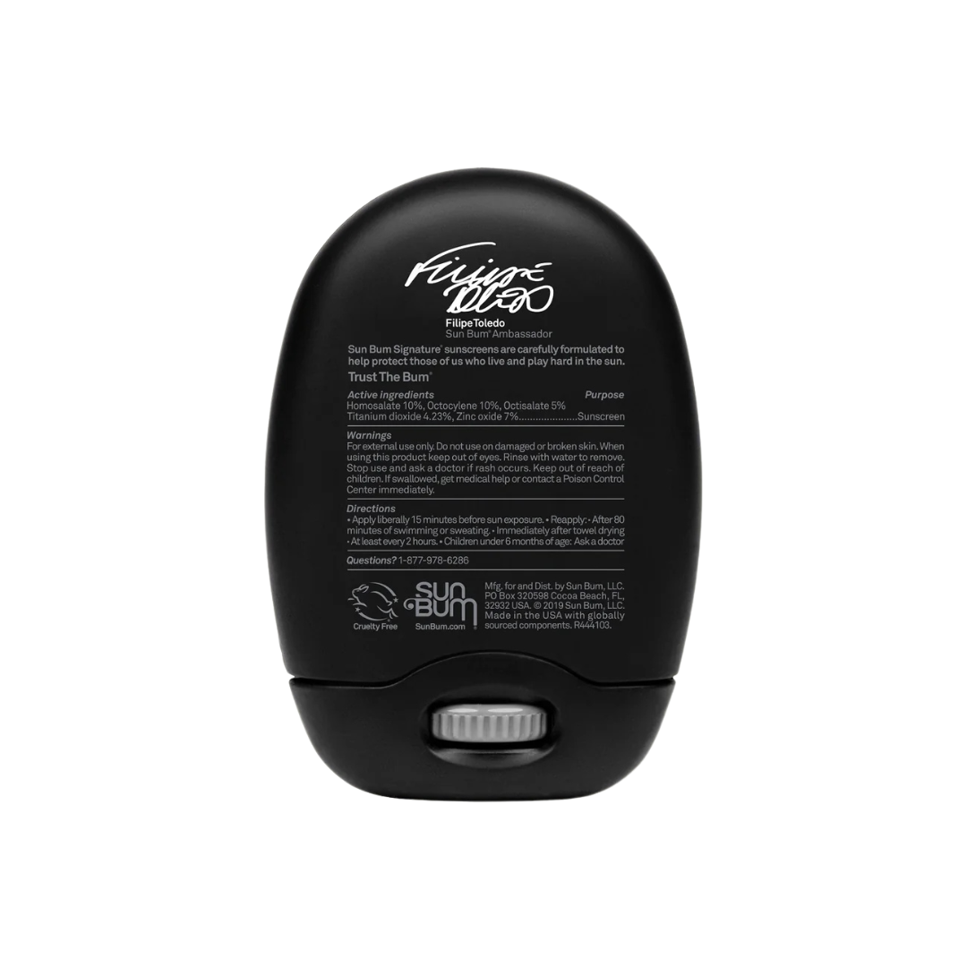 Vista trasera del stick solar Sun Bum Signature SPF 30 con ingredientes activos y advertencias impresas en envase negro"