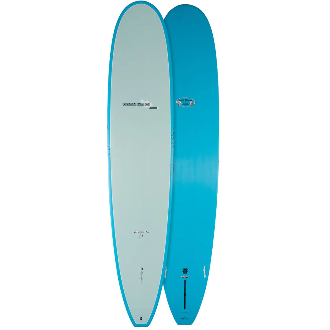 Tabla de surf Surftech Takayama Noah Comp 9'0 longboard performance color azul con deck claro y bottom azul, nose ancho y cola square tail.