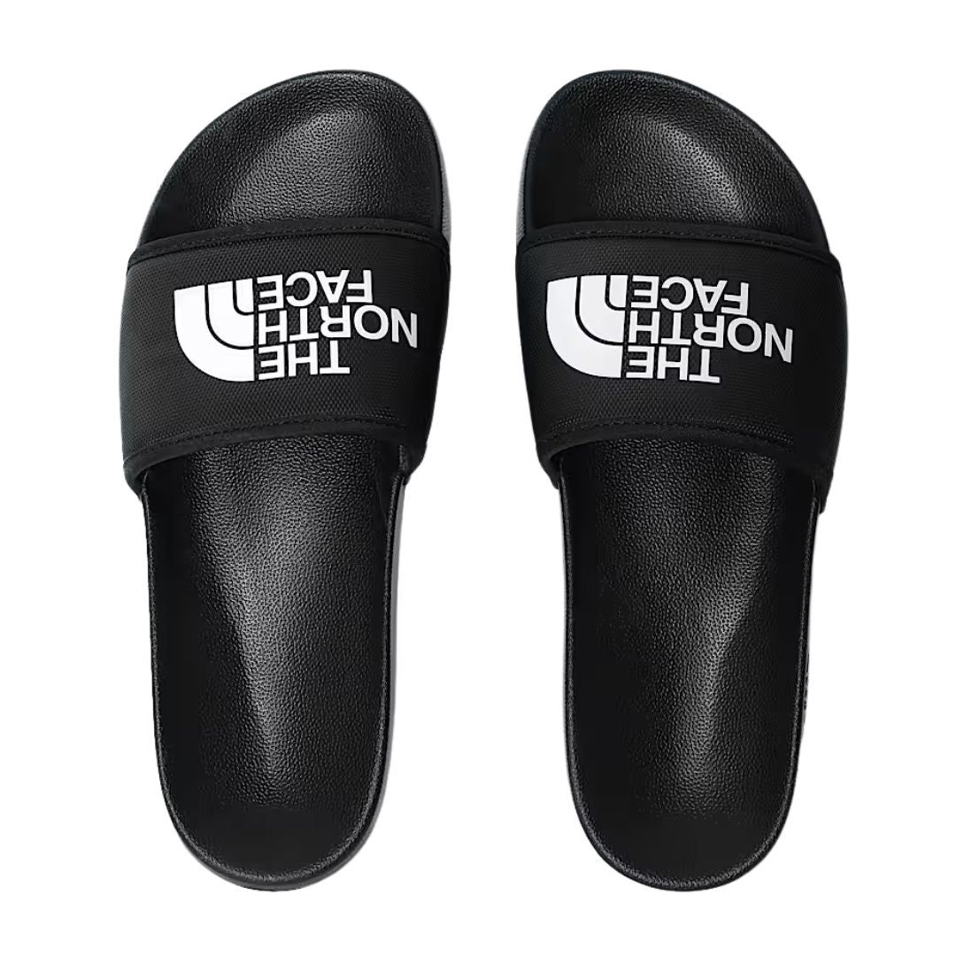 Vista superior del par de chanclas The North Face Base Camp Slide III en color negro con logo blanco.