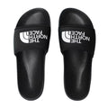 Vista superior del par de chanclas The North Face Base Camp Slide III en color negro con logo blanco.