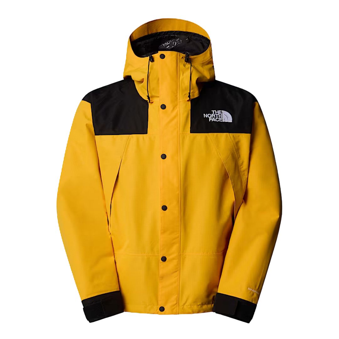 Chaqueta The North Face Dryvent Mono Mountain en color Summit Gold y negro TNF, vista frontal completa con capucha