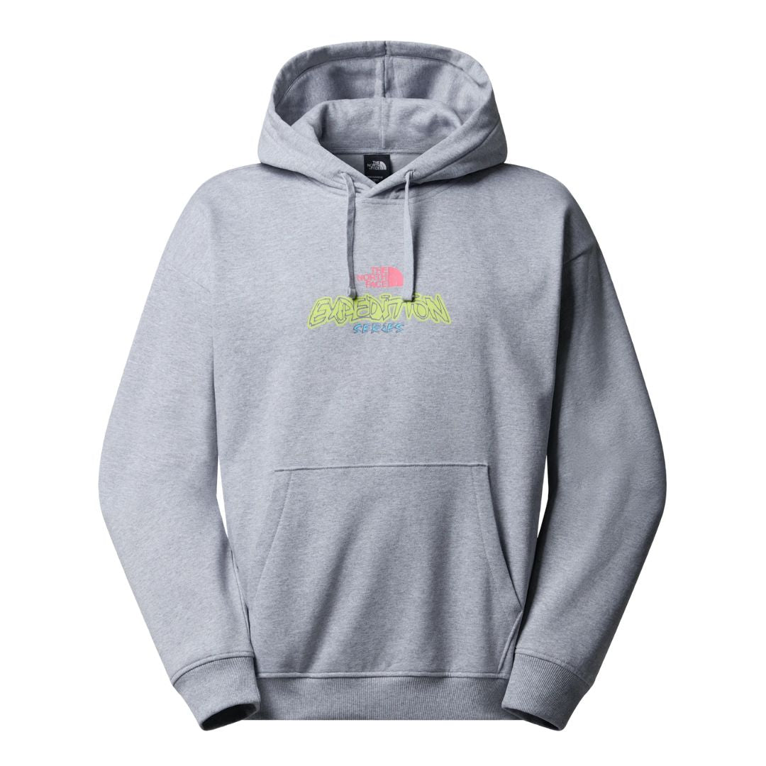 The North Face Expedition Celebration Oversized Hoodie color gris claro vigoré, vista frontal con logo gráfico en el pecho.